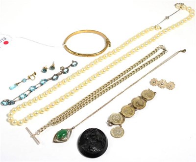 Lot 156 - A 9 carat gold bamboo motif bangle, 7.9 grams; a pair of blue zircon stud earrings, an...