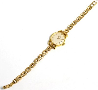 Lot 168 - A lady's 18 carat gold wristwatch signed Omega, on a 9 carat gold bracelet