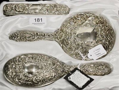 Lot 181 - A silver three piece dressing table set (cased)