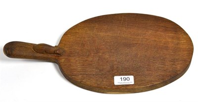 Lot 190 - A Robert ''Mouseman'' Thompson English oak cheese board, 39cm long