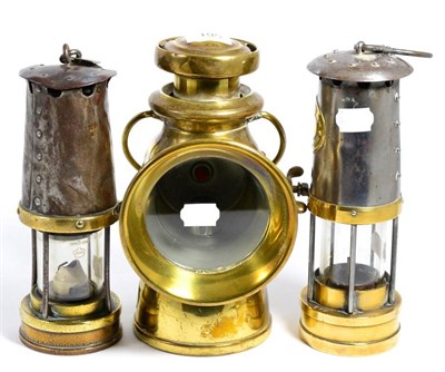 Lot 195 - A Lucas 'King of the Road' brass lamps, no724; together with two miner's lamps including Thomas...