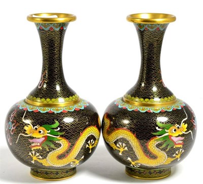 Lot 222 - A pair of cloisonne vases, decorated with dragon chasing flaming pearl, on carved wooden stands