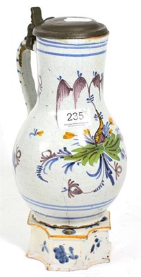 Lot 235 - An 18th century French faience tin-glazed jug with pewter cover, 24cm height with an 18th...