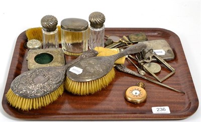 Lot 236 - A group of silver items including a cigarette case; dressing table brushes; travelling watch...