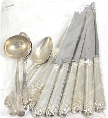 Lot 242 - A group of silver flatware, comprising: a set of five fiddle and shell pattern dessert spoons,...
