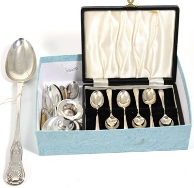 Lot 243 - A Scottish silver spoon; silver teaspoons; pickle forks; and a candlestick