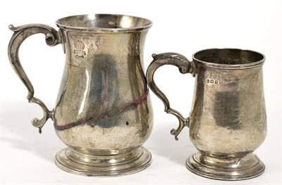 Lot 264 - A George II silver mug, William Shaw & William Priest, London 1756, baluster with scroll...