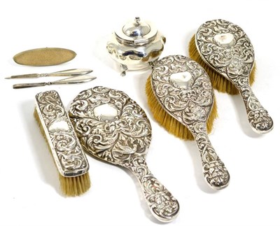 Lot 274 - A silver caddy, Birmingham 1913; a silver part dressing table set Chester 1897; and a part manicure