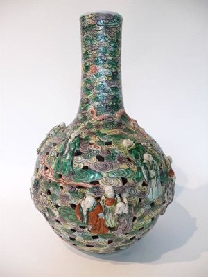 Lot 210 - A Chinese Reticulated Famille Verte Porcelain Bottle Vase, 19th century, the neck carved in...