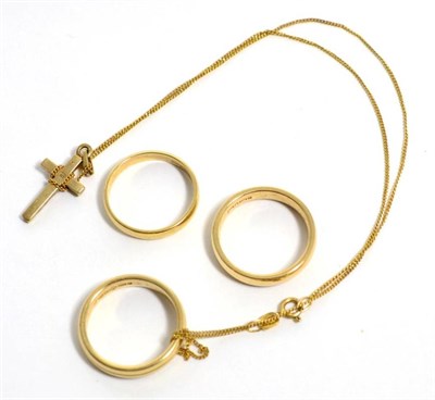 Lot 293 - Three 9 carat gold band rings, finger size N, N1/2 and N1/2; and a cross pendant on chain,...