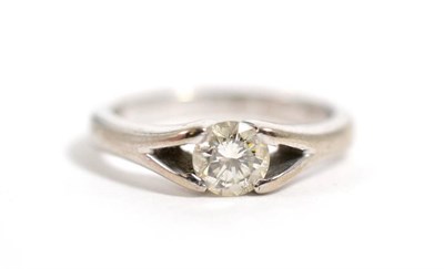 Lot 303 - An 18 carat white gold solitaire diamond ring, stated diamond weight 0.33 carat, finger size F,...