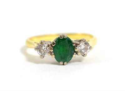 Lot 310 - An 18 carat gold emerald and diamond three stone ring, total estimated diamond weight 0.35...