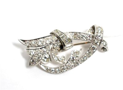 Lot 337 - An Art Deco diamond scroll brooch, total estimated diamond weight   1.70 approximately,...