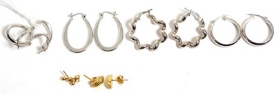 Lot 360 - Four pairs of 9 carat white gold fancy hoop earrings, with lever post fittings and two pairs of...