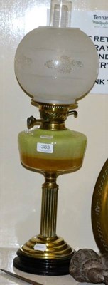 Lot 383 - An early 20th century brass and ebonised oil lamp