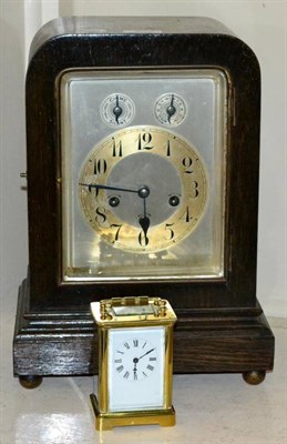 Lot 405 - A brass carriage timepiece; and a German mantel clock (2)