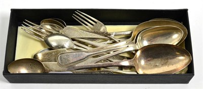 Lot 427 - A group of mixed silver flatware to include fiddle pattern table and dessert spoons, various...