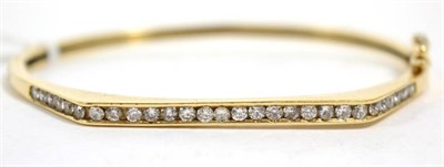 Lot 430 - A 9 carat gold diamond bangle, total estimated diamond weight 0.85 carat approximately,...