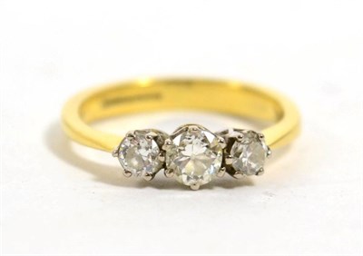 Lot 433 - An 18 carat gold three stone diamond ring, total estimated diamond weight 0.65 carat approximately