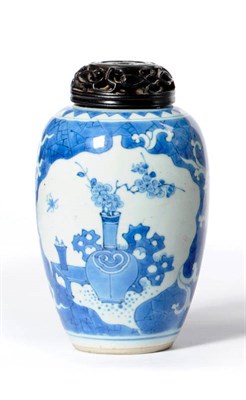 Lot 226 - A Chinese Porcelain Ovoid Jar, Kangxi, painted in underglaze blue with vases of flowers in leaf...