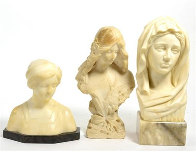 Lot 452 - Two alabaster busts and a resin bust, each depicting a maiden