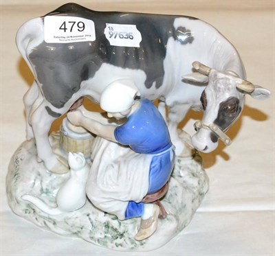 Lot 479 - A Bing & Grondahl model of a cow and milkmaid, signed