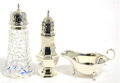 Lot 486 - An octagonal silver caster, Birmingham 1973; a silver mounted glass caster, Sheffield 1937; and...