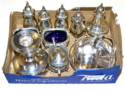 Lot 526 - A set of four silver pepperettes; a pair of salts and a mustard pot; a silver pepperette; a...