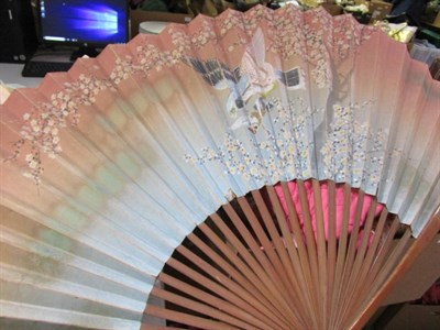 Lot 1009 - A quantity of Chinese and Japanese decorative fans, 19th to 20th century, one bearing a partial...