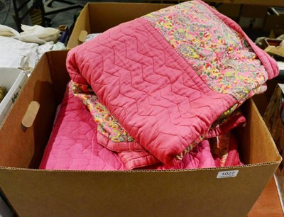Lot 1027 - Three similar circa 1930s pink cotton and paisley/floral printed reversible quilts, wholecloth...