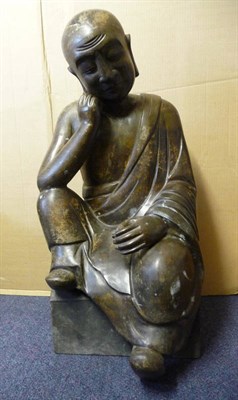 Lot 242 - A Chinese Bronze Seated Figure of a Meditative Martial Arts Expert, 20th century, wearing robes and