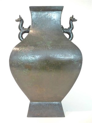 Lot 243 - A Chinese Archaic Style Bronze Jar (Fanghu), of square section baluster form, with beast...