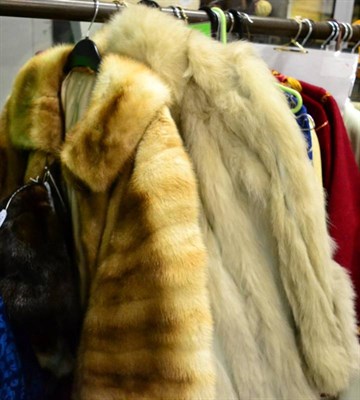 Lot 1086 - White fox fur jacket with cream leather panels, two tone mink jacket with collar, side pockets, and