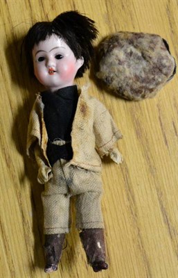 Lot 1098 - A German Gebruder Knoch bisque head miniature doll, fully clothed in driving suit and hat with...