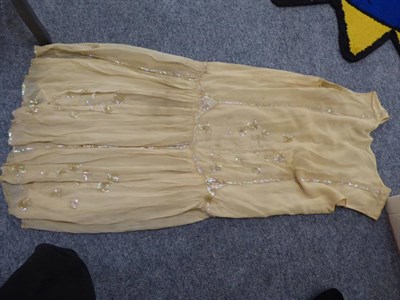 Lot 1116 - 1927 Derby Day wedding dress in dark cream chiffon dress with sequin and bead decoration...