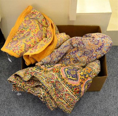 Lot 1118 - Red, blue and yellow printed whole cloth bed cover with a cream reverse, 160cm by 205cm; a...