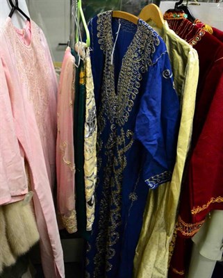 Lot 1120 - Six circa 1960s and 70s white and cream wedding dresses, Indian silk tunics, saris, gents...