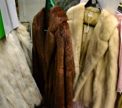 Lot 1122 - Blond mink short jacket with faux double breasted button fastening; and a brown fur jacket...