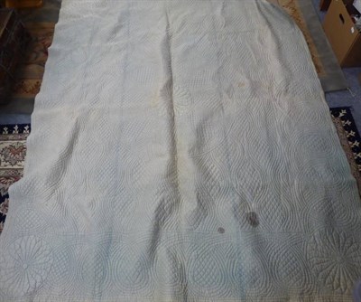 Lot 1125 - Late 19th century floral quilt with pale blue reverse, and another in yellow (2)