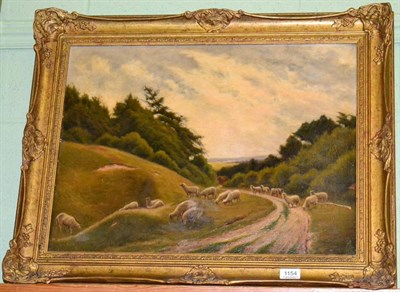 Lot 1154 - W Swain, sheep on a country path, signed, oil on canvas