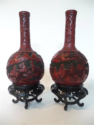 Lot 258 - A Pair of Chinese Cinnabar Lacquer Bottle Vases, late 19th century, each worked in flat relief with