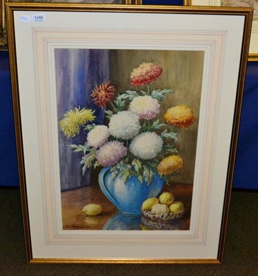 Lot 1248 - Tom Whitehead (20th century), still life with flowers in a blue vase and lemons, signed and...