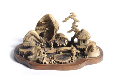 Lot 260 - A Japanese Carved Antler Tea Pavilion Landscape Carving, Meiji period (1868-1912), with a small tea