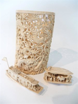 Lot 262 - A Chinese Carved Elephant Tusk Section Sleeve Vase or Brush Pot, circa 1900, reticulated with...