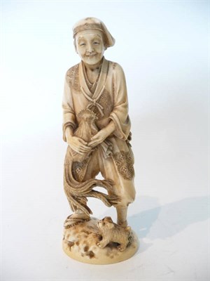 Lot 264 - A Japanese One Piece Carved Ivory Figure of a Countryman, late Meiji period (1868-1912), he...