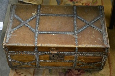 Lot 1326 - An 18th/19th century hide travelling trunk, bearing ''Ann Sunnoks... Trunk Manufactory, No 150...