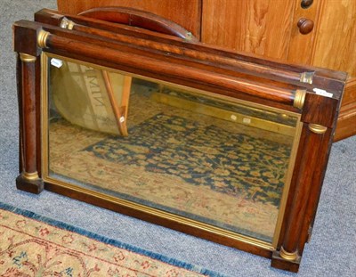 Lot 1373 - A 19th century rosewood overmantel mirror; another similar example; and an arched mirror (3)