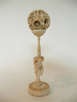 Lot 271 - A Chinese Carved Elephant Ivory and Walrus Concentric Puzzle Ball on Stand, circa 1930, the...