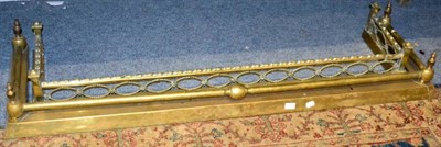 Lot 1379 - Two early 20th century brass fenders