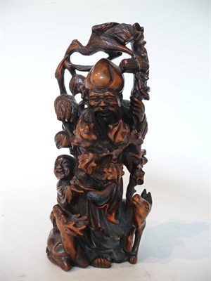 Lot 272 - A Chinese One-Piece Carved Hardwood Figure of Shou Lao, early 20th century, standing holding a...